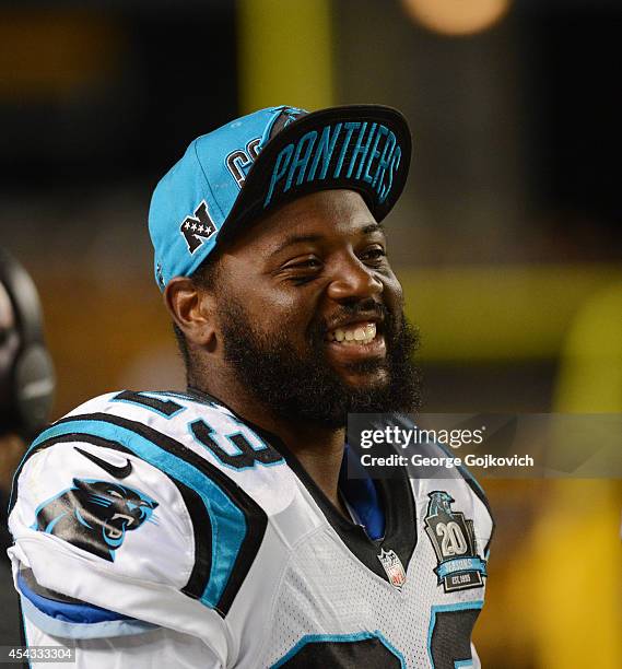 Cornerback Melvin White of the Carolina Panthers smiles as he looks on from the sideline during a preseason game against the Pittsburgh Steelers at...