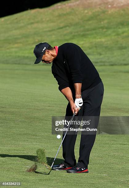 Tiger Woods hits his second shot on the 10th hole during the final round of the Northwestern Mutual World Challenge at Sherwood Country Club on...