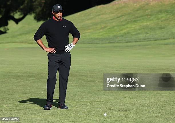 Tiger Woods studies his second shot on the 10th hole during the final round of the Northwestern Mutual World Challenge at Sherwood Country Club on...
