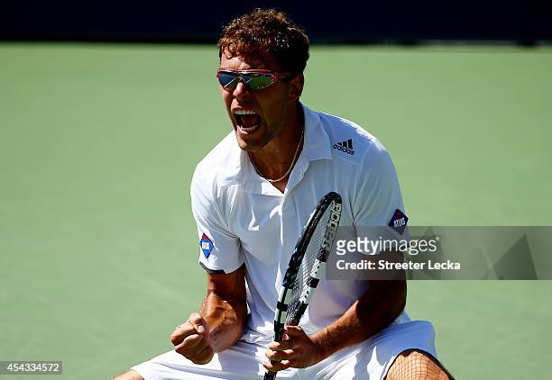 Jerzy Janowicz of Poland reacts after a point against Kevin Anderson of South Africa during their men's singles second round match on Day Five of the...