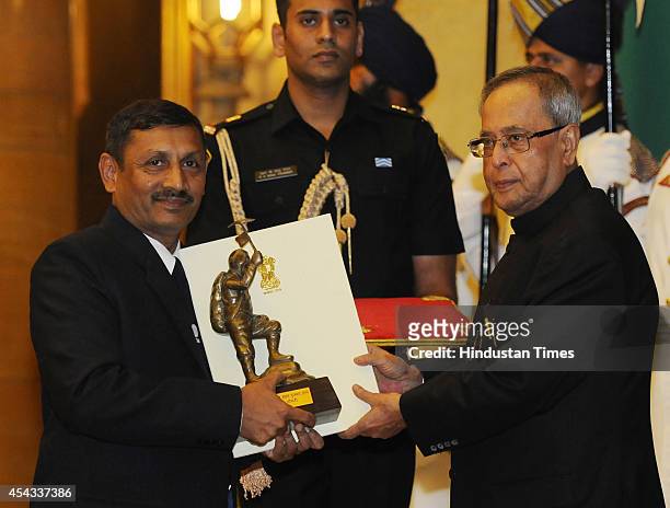 President Pranab Mukherjee presents Tenzing Norgay Award 2014 to Wing Commander Amit Chowdhury at the National Sports and Adventure Awards function...