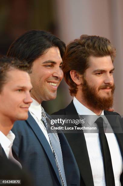 Producers Arcadiy Golubovich, Kevin Turen and actor Andrew Garfield attend the '99 Homes' photocall during the 71st Venice Film Festival on August...