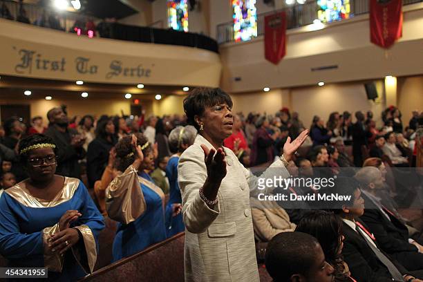 Congregation members worship at a service to honor the late South African President and anti-apartheid leader Nelson Mandela, at the First AME Church...