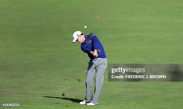 Golfer Zach Johnson plays a shot to the green at the 7th hole during the final round of play at the Northwestern Mutual World Challenge golf...