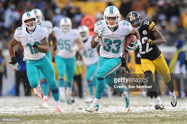 Miami's Daniel Thomas breaks free for a 55-yards gain in the fourth quarter as the Miami Dolphins beat the Pittsburgh Steelers 34-38 at Heinz Field...