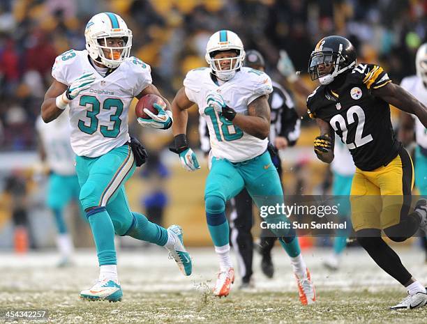 Miami's Daniel Thomas breaks free for a 55-yards gain in the fourth quarter as the Miami Dolphins beat the Pittsburgh Steelers 34-38 at Heinz Field...