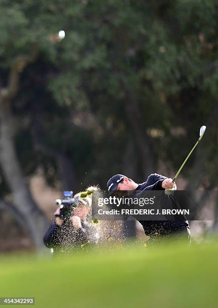 Australian golfer Jason Day plays a shot to the green at the 18th hole during the final round of play at the Northwestern Mutual World Challenge golf...