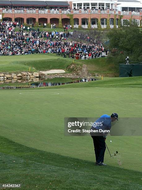 Matt Kuchar hits an approach shot to the 18th green during the final round of the Northwestern Mutual World Challenge at Sherwood Country Club on...