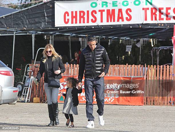 Ellen Pompeo, Chris Ivery and their daughter, Stella Ivery are seen buying a Christmas Tree on December 08, 2013 in Los Angeles, California.