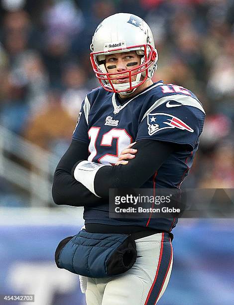 Patriots quarterback Tom Brady is visibly upset as he walks around on the field as teammate Rob Gronkowski, not pictured, receives medical attention...