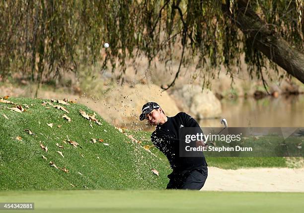 Jason Day of Australia hits out of a bunker on the second hole during the final round of the Northwestern Mutual World Challenge at Sherwood Country...