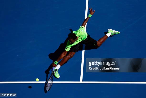 Gael Monfils of France returns a shot to Alejandro Gonzalez of Columbia during their men's singles second round match on Day Five of the 2014 US Open...