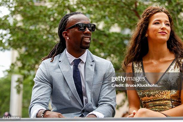 National League All-Star Andrew McCutchen of the Pittsburgh Pirates rides with his fiancee Maria Hanslovan in the Red Carpet Parade leading to the...