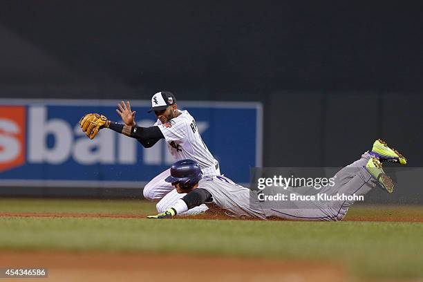 National League All-Star Troy Tulowitzki of the Colorado Rockies doubles as American League All-Star Alexei Ramirez of the Chicago White Sox catches...