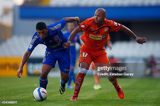 Isaac Diaz of Universidad de Chile, struggles for the ball with Sebastian Rocco of Cobreloa during a match between Cobreloa and Universidad de...