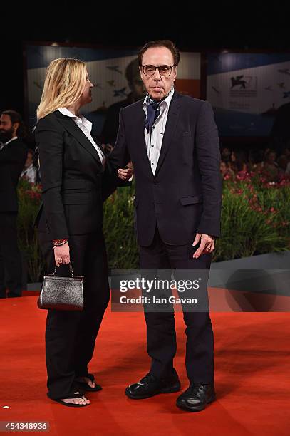 Producer Louise Stratten and director Peter Bogdanovich wearing a Jaeger-LeCoultre watch attend the 'She's Funny That Way' during the 71st Venice...