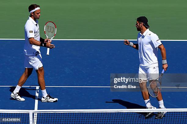 Robert Lindstedt of Sweden and Jurgen Melzer of Austria during their men's doubles second round match against Eric Butorac of the United States and...