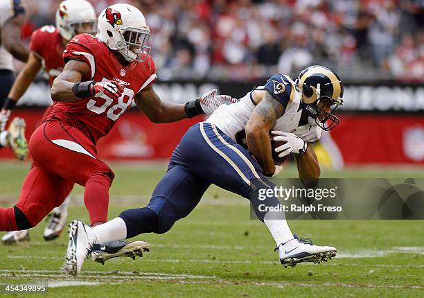 Tight End Lance Kendricks of the St Louis Rams runs after a catch as Daryl Washington of the Arizona Cardinals defends during the second quarter of...