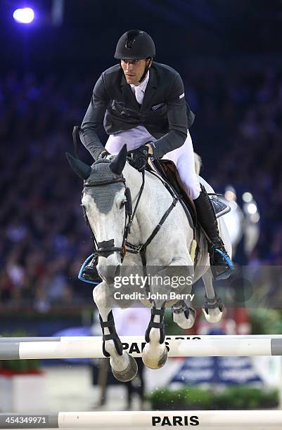 Kevin Staut of France riding Silvana Hdc wins the Grand Prix Gucci at the Parc des Expositions Paris Nord Villepinte on December 8, 2013 in...