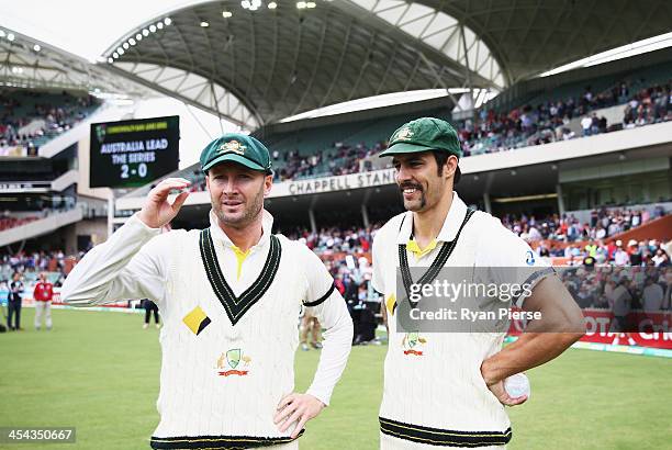 Michael Clarke of Australia and Mitchell Johnson of Australia look on after day five of Second Ashes Test Match between Australia and England at...