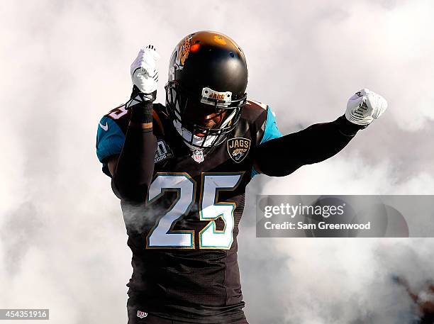 Sherrod Martin of the Jacksonville Jaguars enters the stadium before the preseason NFL game against the Atlanta Falcons at EverBank Field on August...