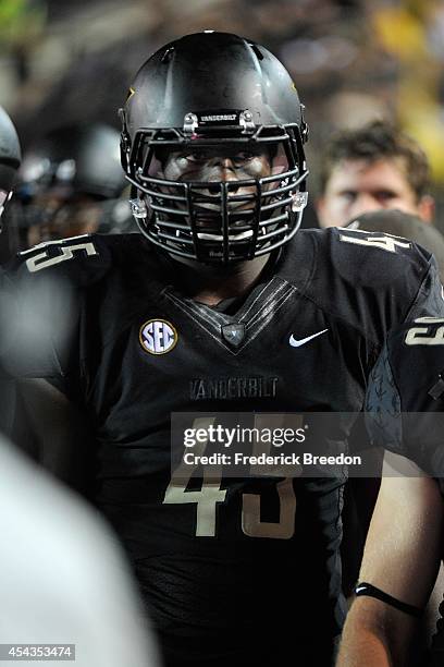 Stephen Weatherly of the Vanderbilt Commodores watches from the sideline during a game against the Temple Owls at Vanderbilt Stadium on August 28,...