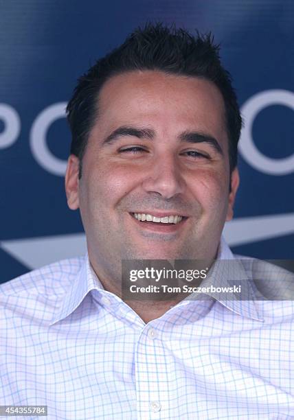 General manager Alex Anthopoulos of the Toronto Blue Jays talks to reporters in the dugout before the start of MLB game action against the Baltimore...