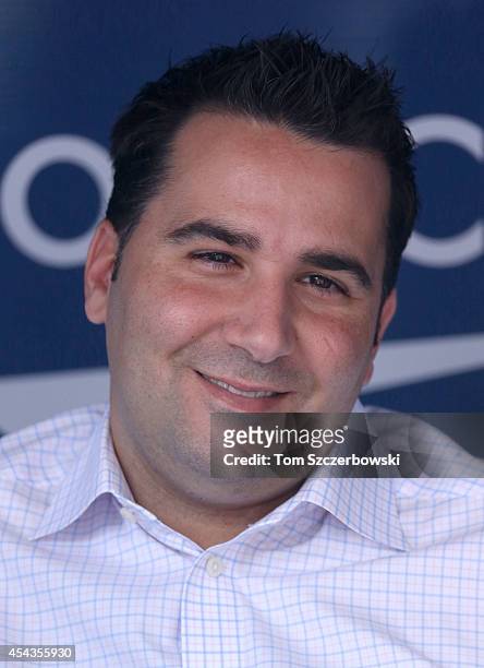 General manager Alex Anthopoulos of the Toronto Blue Jays talks to reporters in the dugout before the start of MLB game action against the Baltimore...