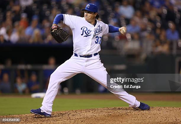 Scott Downs of the Kansas City Royals throws in the seventh inning against the Cleveland Indians at Kauffman Stadium on August 29, 2014 in Kansas...