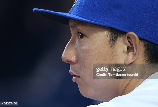 Munenori Kawasaki of the Toronto Blue Jays looks on from the dugout during MLB game action against the New York Yankees on August 29, 2014 at Rogers...