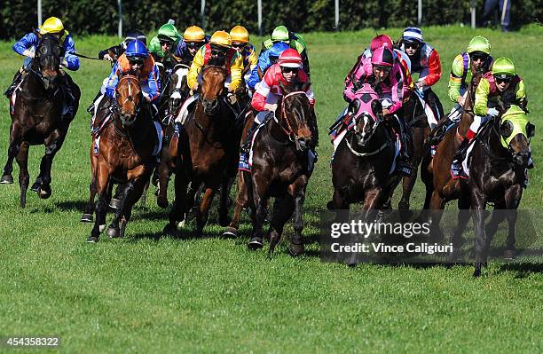 Vlad Duric riding Late Charge turns into the home straight before winning Race 4 during Melbourne Racing at Caulfield Racecourse on August 30, 2014...