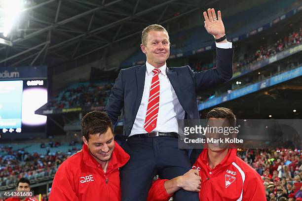 Retiring Swans player Ryan O'Keefe is chaired from the field after a lap of honour during the half time break of the round 23 AFL match between the...