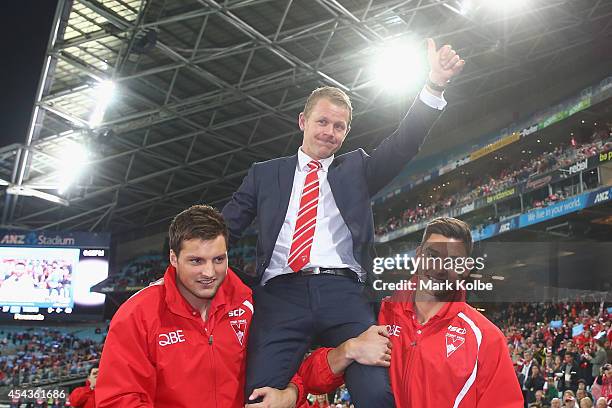 Retiring Swans player Ryan O'Keefe is chaired from the field after a lap of honour during the half time break of the round 23 AFL match between the...