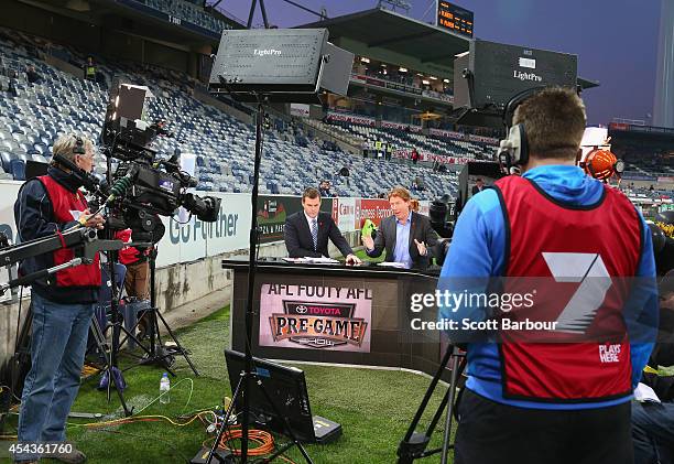 Cameron Ling speaks to camera as Channel 7 film their pre-game show before the round 23 AFL match between the Geelong Cats and the Brisbane Lions at...