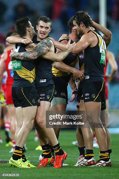 Nathan Gordon and Dustin Martin of the Tigers celebrate victory during the round 23 AFL match between the Sydney Swans and the Richmond Tigers at ANZ...