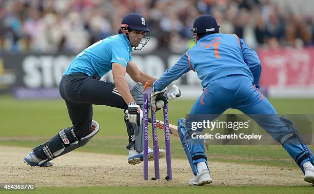 England captain Alastair Cook is stumped by Mahendra Singh Dhoni of India during the 3rd Royal London One-Day International match between England and...