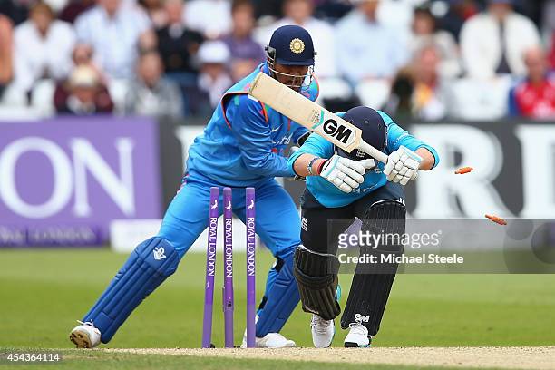 Joe Root of England is stumped by MS Dhoni of India off the bowling of Ravindra Jadeja during the third Royal London One-Day Series match between...