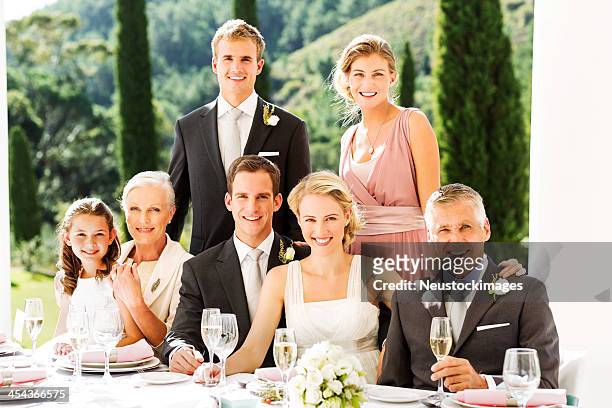 happy couple and guests at wedding reception - familys revenge of the bridesmaids stockfoto's en -beelden