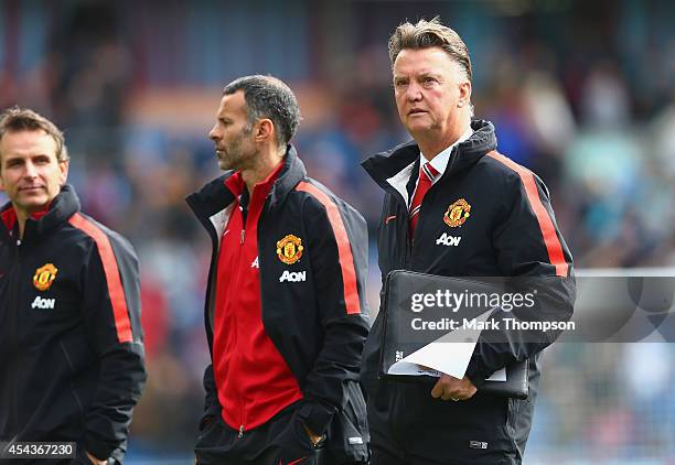 Assistant Ryan Giggs of Manchester United and Manager Louis van Gaal of Manchester United look on during the Barclays Premier League match between...