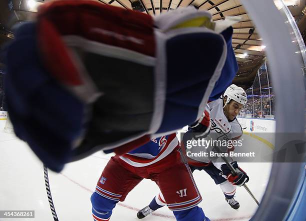 Aaron Volpatti of the Washington Capitals and Justin Falk of the New York Rangers collide during the first period at Madison Square Garden on...