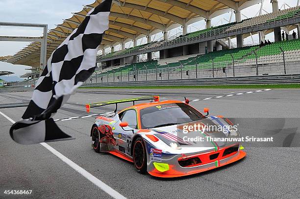 Weng Sun Mok of Malaysia and Toni Vilander of Finland dives the Clearwater Racing Ferrari 458 GT3 during the Asian Lemans Series on December 8, 2013...