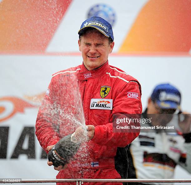 Toni Vilander of Finland driver of Clearwater Racing Ferrari 458 GT3 celebrate after the Asian Lemans Series on December 8, 2013 in Sepang, Selangor,...