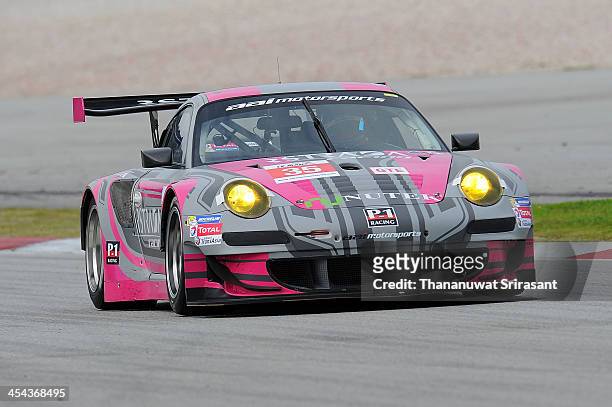 Marco Seefrie of Japan, Morris Chen of Great Britain and Ryohei Sakaguchi of Japan dives the AAI-RSTRADA Porche 997 RSR during the Asian Lemans...