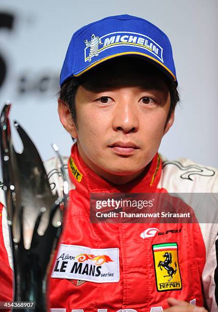 Akira Iida of Japan driver of Team Taisan Ken Endless Ferrari 458 GTE during press conference after the Asian Lemans Series on December 8, 2013 in...