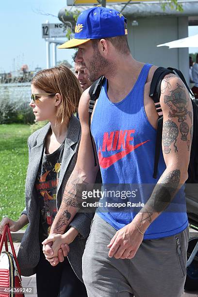 Kate Mara and Johnny Wujek are seen arriving at Venice Airport during The 71st Venice International Film Festival on August 30, 2014 in Venice, Italy.