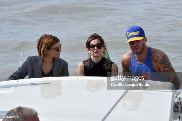 Kate Mara, Felicity Jones and Johnny Wujek are seen arriving at Venice Airport during The 71st Venice International Film Festival on August 30, 2014...