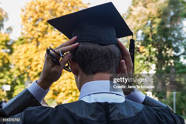 Graduate in gown and caps celebrate their graduation at the HHL Leipzig Graduate School of Management on August 30, 2014 in Leipzig, Germany. A total...