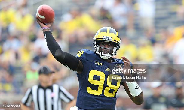 Michigan Wolverines quarterback Devin Gardner warms up prior to the start of the game against Appalachian State at Michigan Stadium on August 30,...