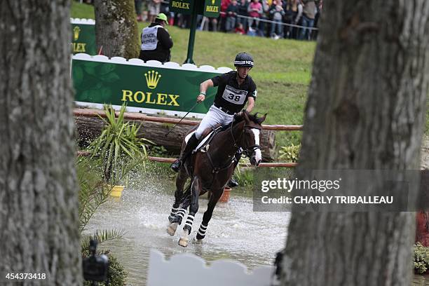 New-Zealand Tim Price rides Wesko on August 30, 2014 during the timetable cross-country test of the 2014 FEI World Equestrian Games at the Haras du...