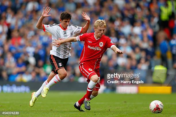 Mats Daehli of Cardiff City is challenged by Emerson Hyndman of Fulham during the Sky Bet Championship match between Fulham and Cardiff City at...